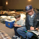 Dan Weaver and grandson Preston Mullen, 7, of Groves, Texas, pass time in a church shelter in Lufkin, Texas, where thousands of people were stranded after evacuating the gulf coast of Texas to avoid Hurricane Rita on Sept. 24, 2005.